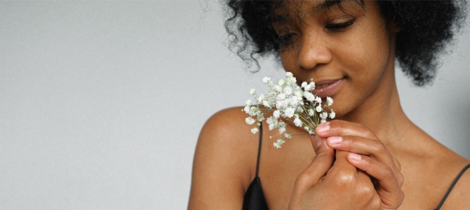 women smelling baby's breath flowers