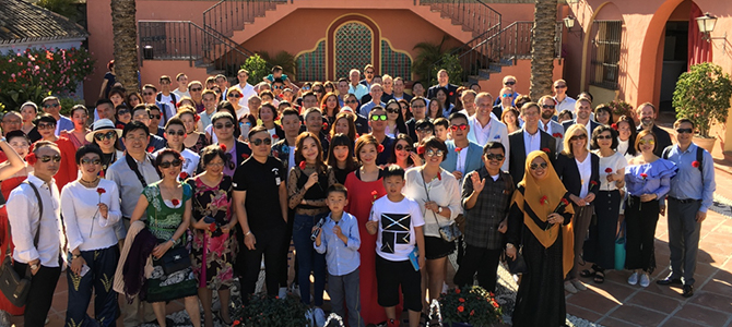 A large group of Nu Skin sales leaders and Nu Skin management pose for a picture outside in Barcelona.